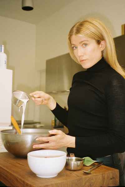 Coconut Raspberry Lime Leaf Cake KitEditorial Image of person making cake
