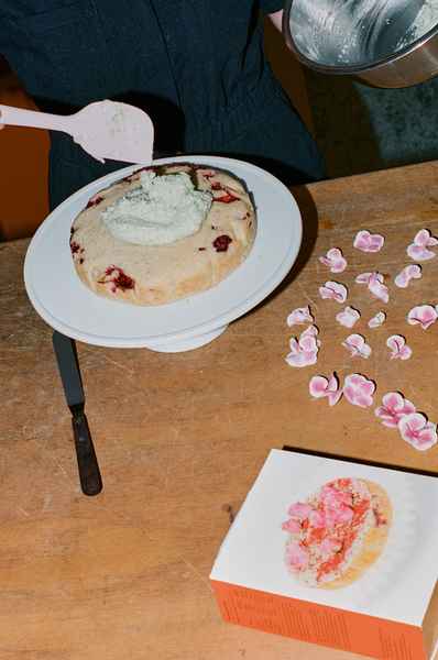Coconut Raspberry Lime Leaf Cake KitEditorial Image of person making cake