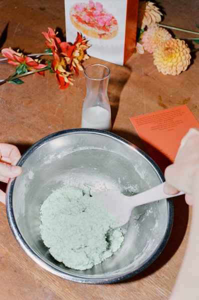 Coconut Raspberry Lime Leaf Cake KitEditorial Image of person making cake