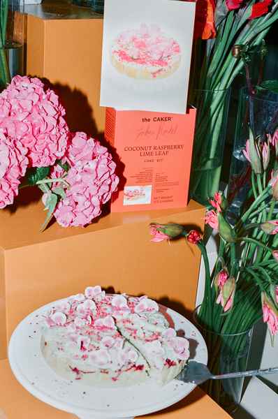 Coconut Raspberry Lime Leaf Cake KitEditorial Image of person making cake