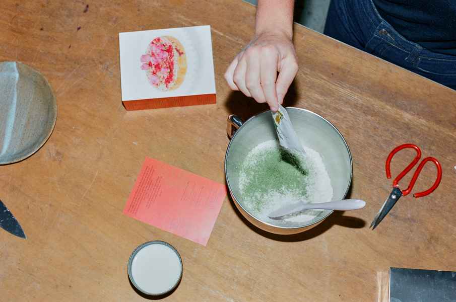 Coconut Raspberry Lime Leaf Cake KitEditorial Image of person making cake