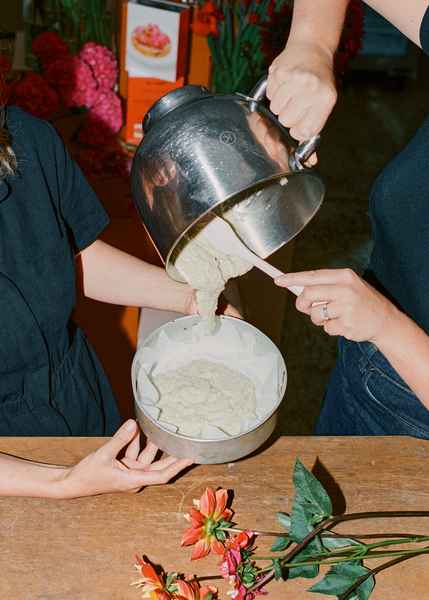 Coconut Raspberry Lime Leaf Cake KitEditorial Image of person making cake
