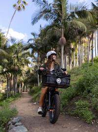 Woman riding an electric bike on a trail