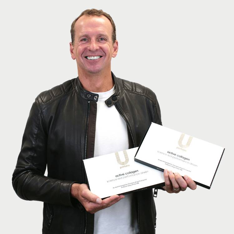 U Perform co founder Professor Greg Whyte OBE Sports Scientist Olympian holding Active Collagen supplements