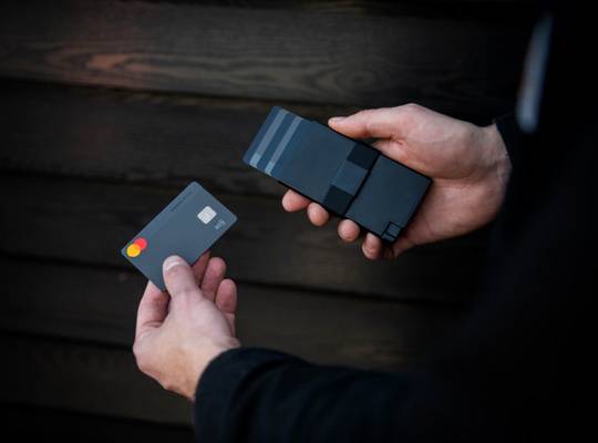 Hand holding an Aluminum Cardholder