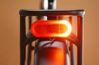 Close up of a Radster Trail electric off-road bike rear light, featuring brake lights and rear-facing turn signals