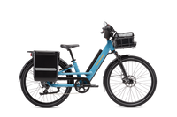Blue Radster Road electric commuter bike with a hardshell locking pannier, front basket with liner bag, mirror and phone mount installed.