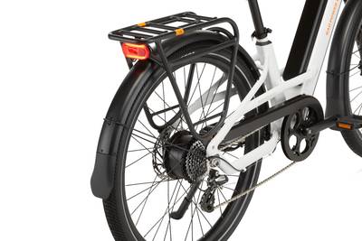 Zoomed in image of the rear wheel of a Radster Road electric commuter bike. Image shows the chain guard and rear rack.