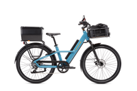 Blue Radster Road electric commuter bike in size Large with a hardshell locking box, front basket with roll top liner bag, mirror and phone mount installed.