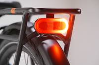 Close up of a Radster Road electric commuter bike rear light, featuring brake lights and rear-facing turn signals