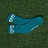 pair of green socks on grass