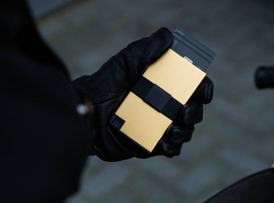 18K Gold Cardholder held in hand