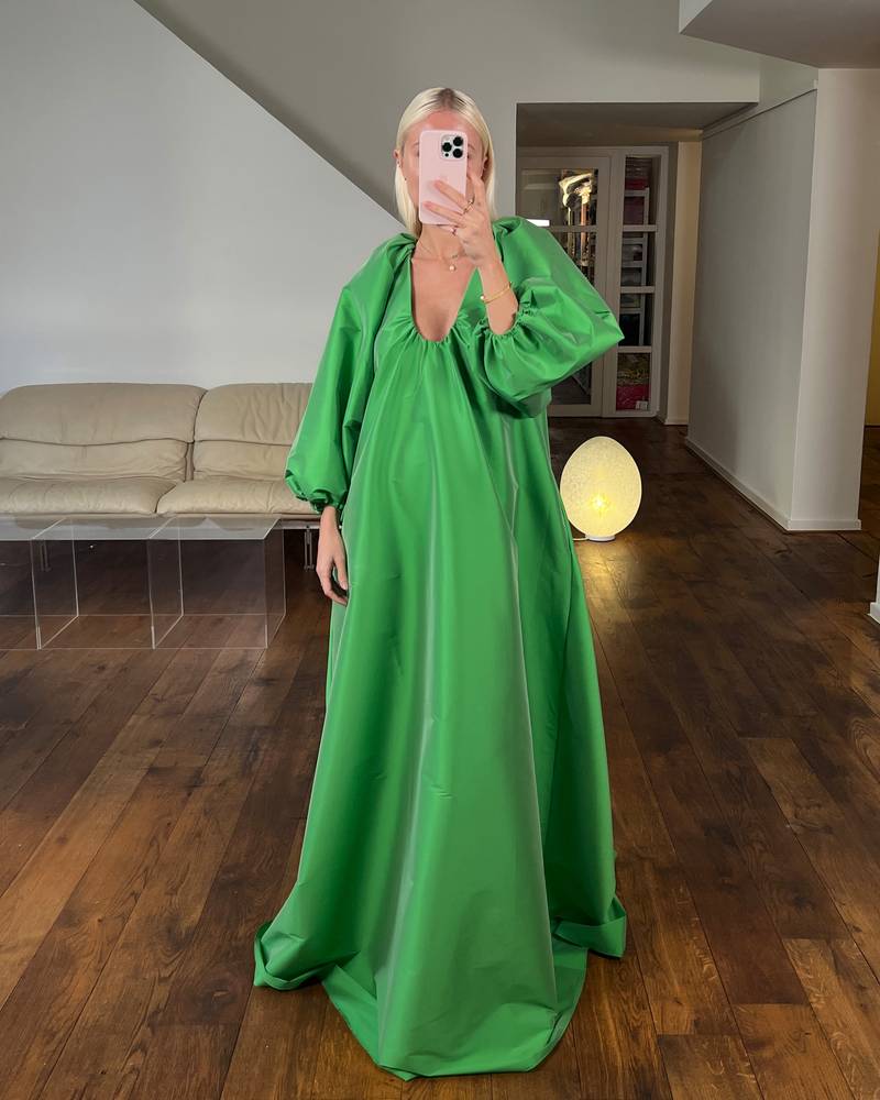 Bernadette Antwerp Dress George is made from taffeta fabric, features poofy sleeves and is floor-length. Taffeta evening wear grass green.