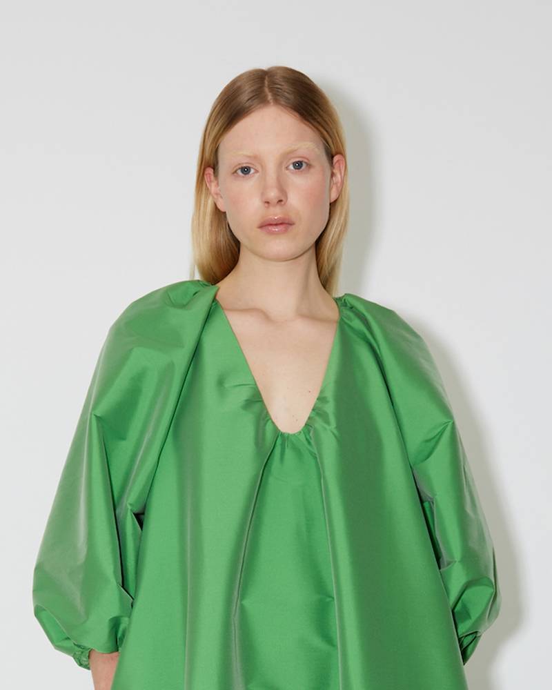 Bernadette Antwerp Dress George is made from taffeta fabric, features poofy sleeves and is floor-length. Taffeta evening wear grass green.