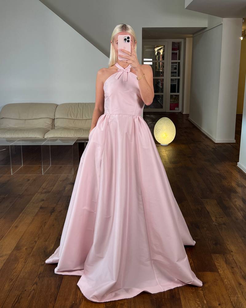 Bernadette Antwerp taffeta gown in blush pink with a halter neck that flows into a floor-length gown