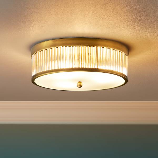 Round Roddy IP44 flush ceiling light in antique brass and clear glass