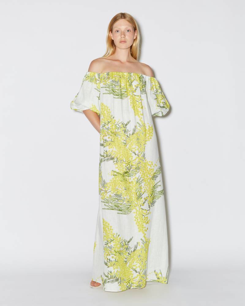 Bernadette Antwerp dress Zaza is a floor-length dress made from linen, featuring a straight neckline, poofy off-the-shoulder sleeves and a detachable belt to accentuate the waist. Dress Zaza is adorned with the Mimosa print on White.