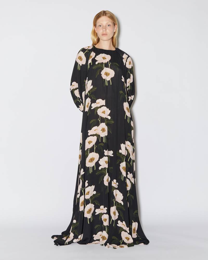 Bernadette Antwerp dress Frida is a floor length dress/ gown with long poofy sleeves and a subtle open back, adorned with the Big Peonies print on a black base.