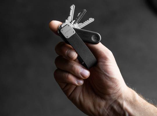 Hand holding the keytracker with keys fanned out