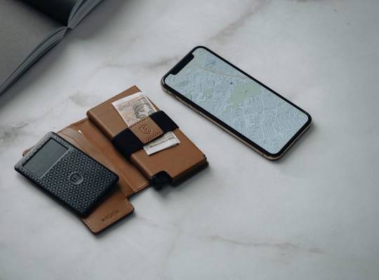 Parliament slim wallet sitting next to a smartphone
