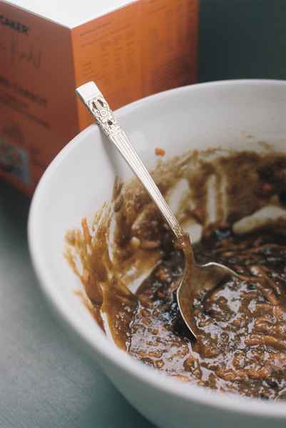 Spiced Carrot Cake Kit with Salted CaramelEditorial Image of person making cake