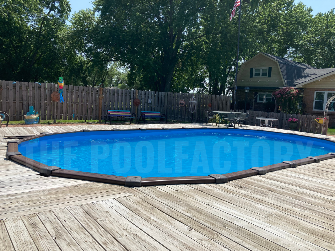 Oval semi-inground swimming pool with a stylish wooden deck surrounding