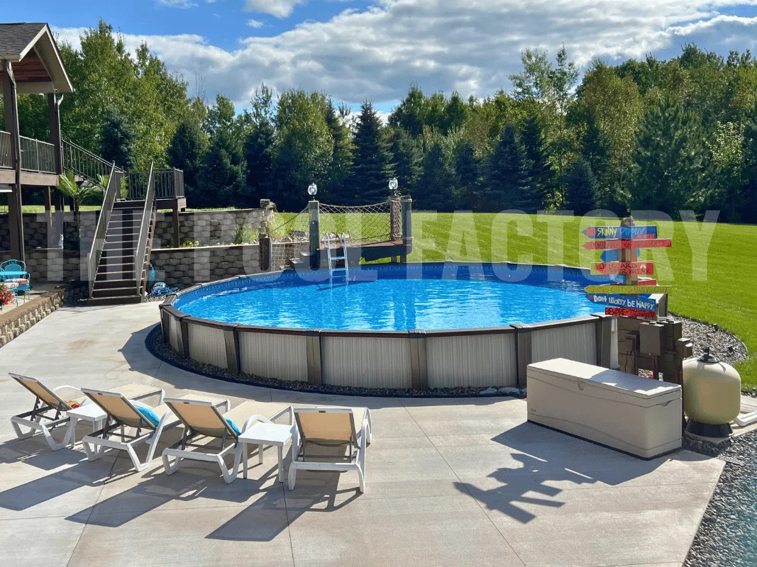 Round swimming pool with concrete patio and outdoor lounge chairs