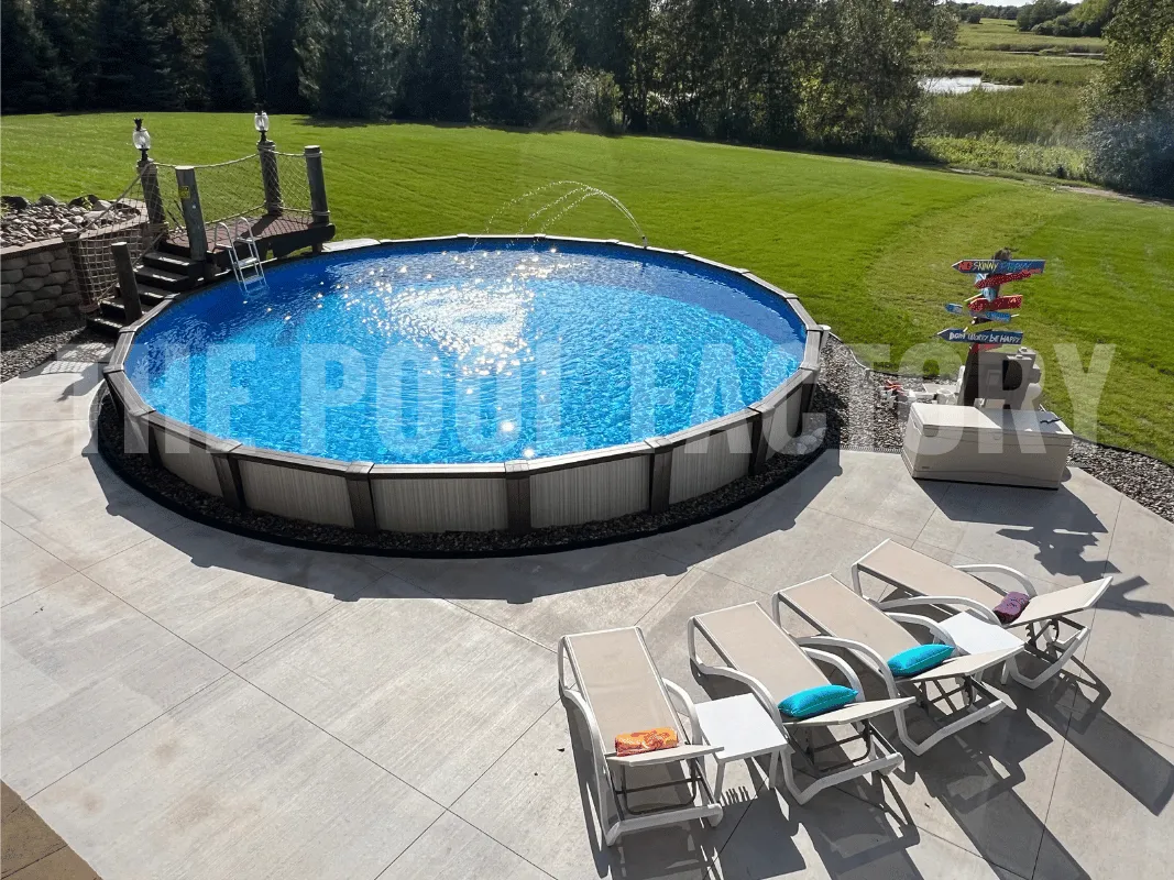 Luxury above ground pool with concrete patio and poolside chairs