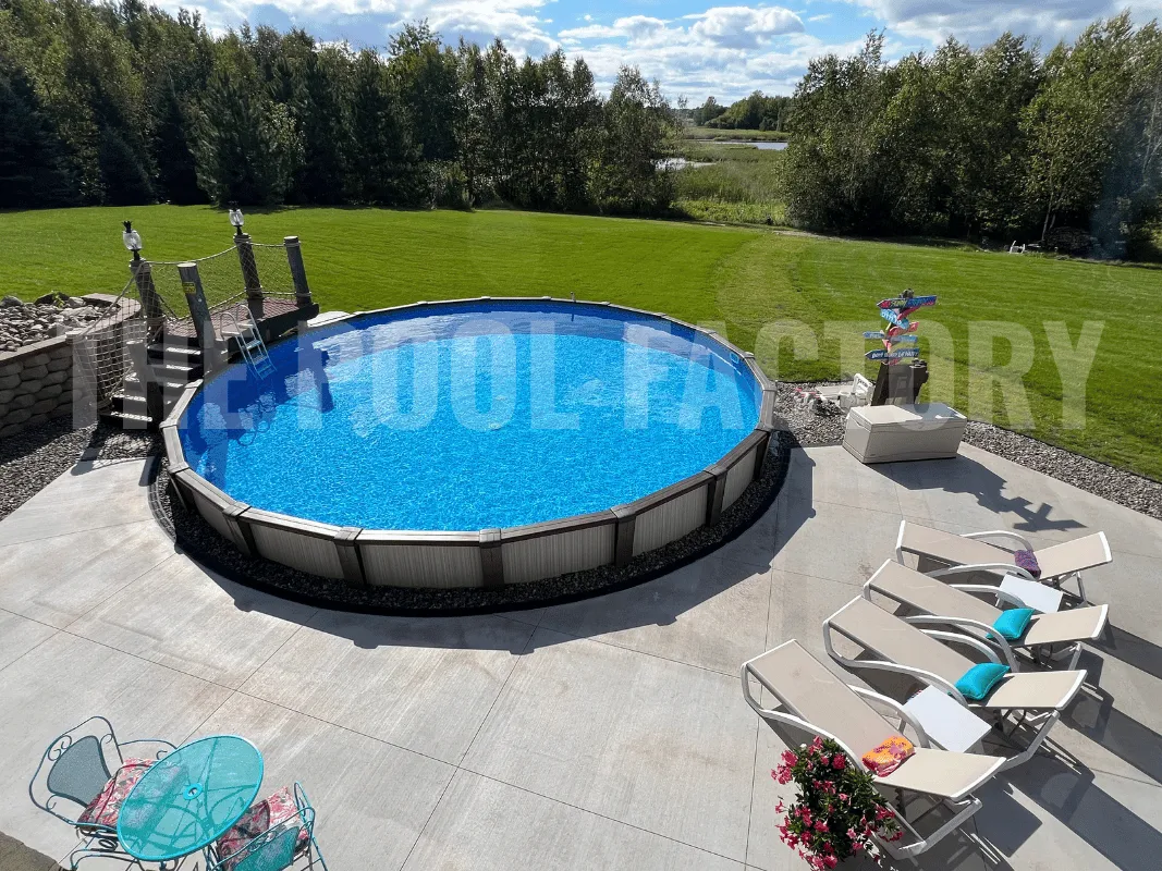 Round above ground pool featuring concrete patio and comfortable seating area