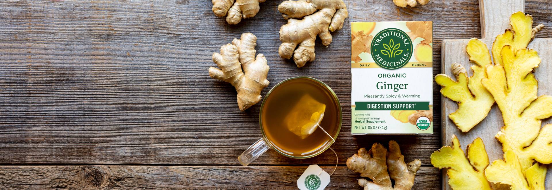 ginger herbal tea tags and cup on a table