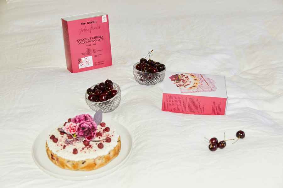 Cherry Coconut Dark Chocolate Cake KitEditorial Image of person making cake