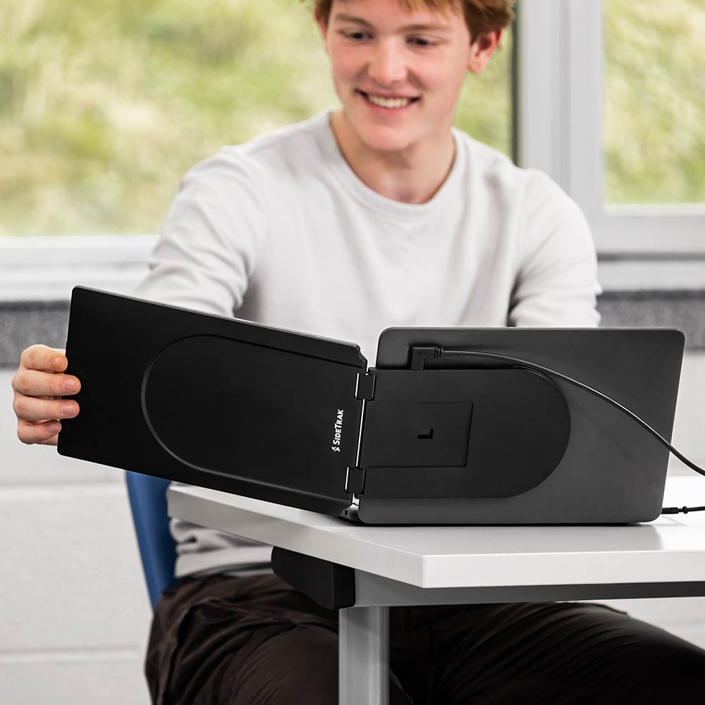 Photo of a student adjusting his SideTrak Swivel Essential portable monitor easily 