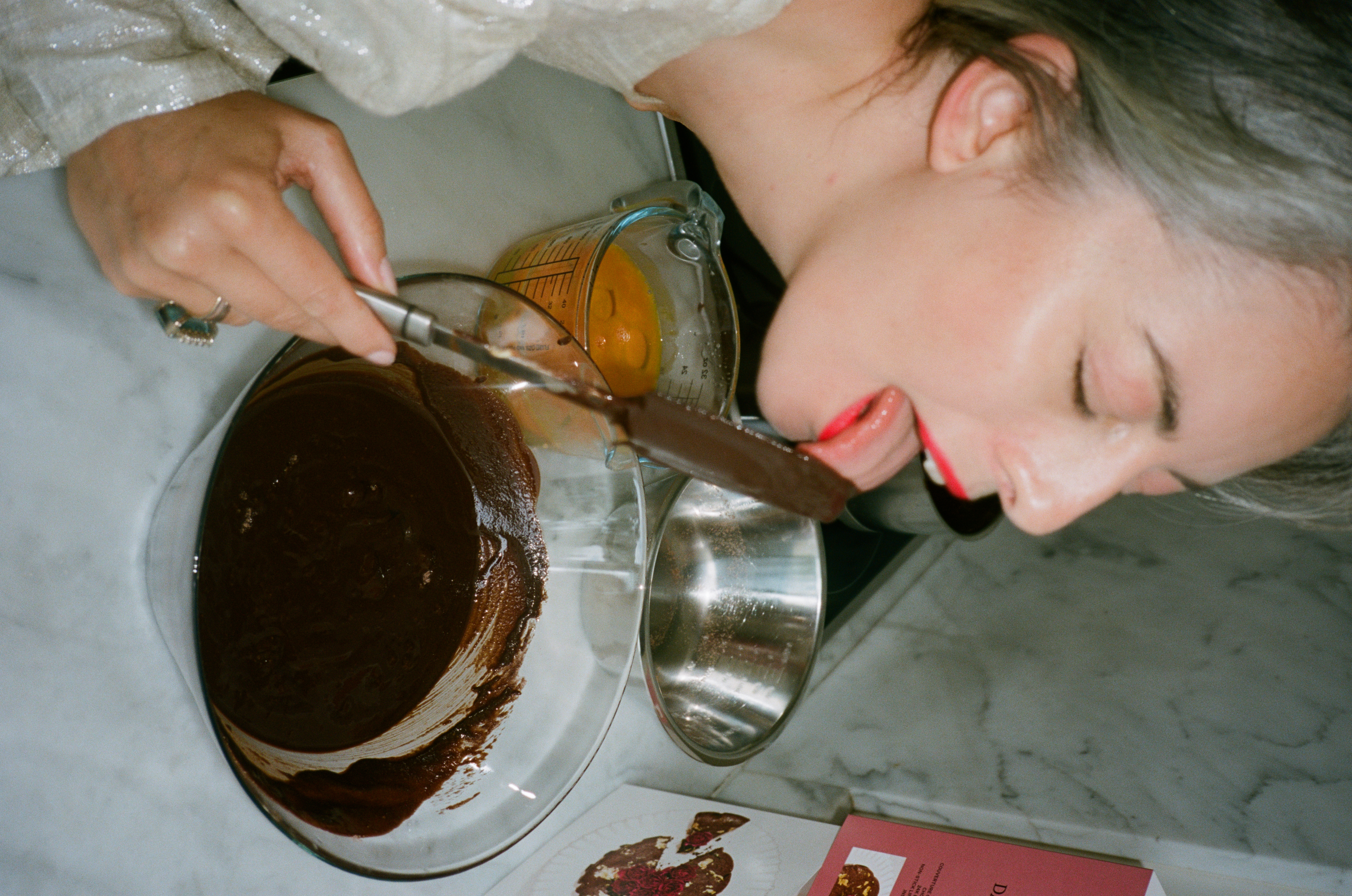 Flourless Dark Chocolate Gold Leaf Cake KitEditorial Image  of person making cake