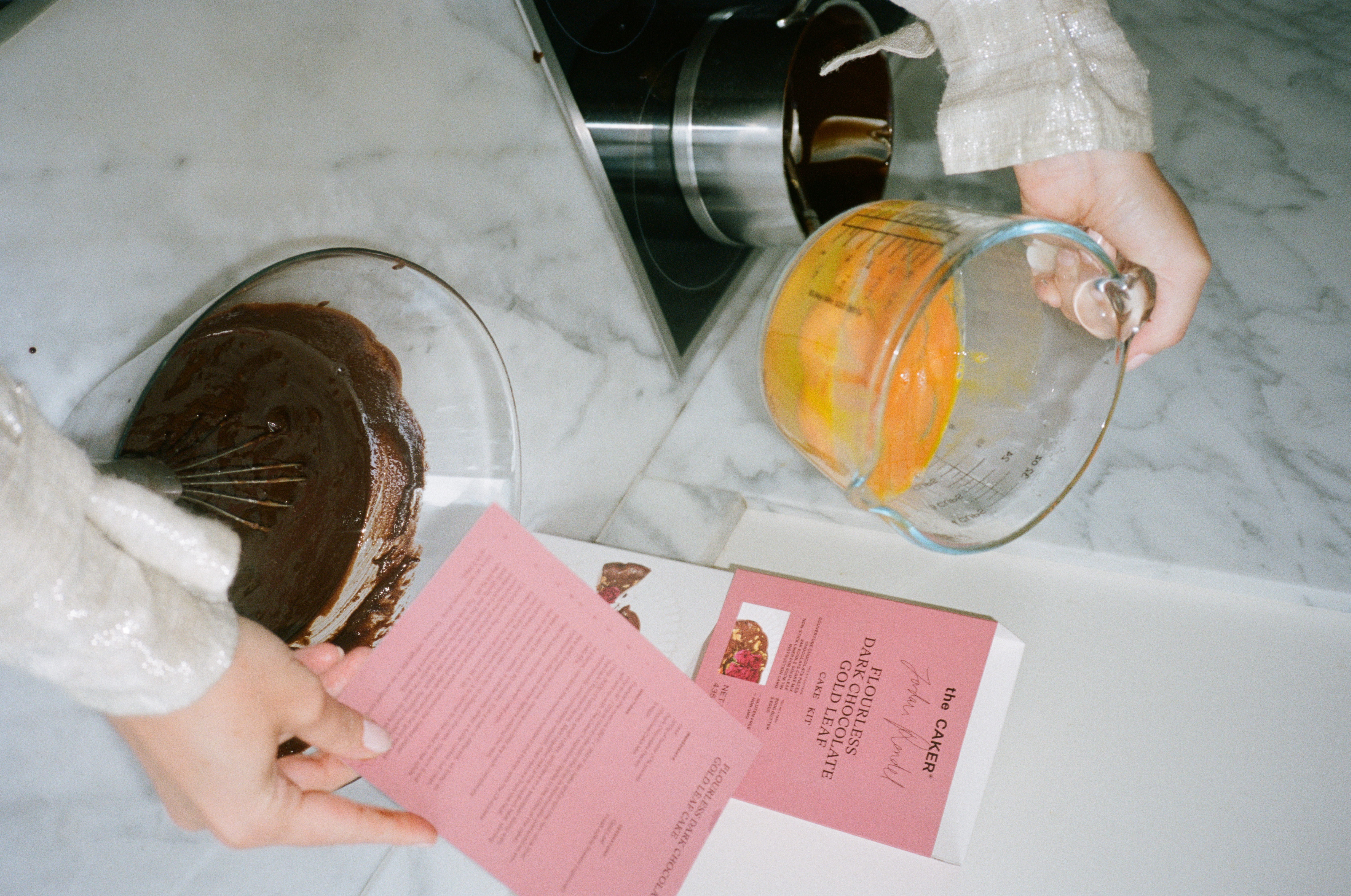 Flourless Dark Chocolate Gold Leaf Cake KitEditorial Image  of person making cake