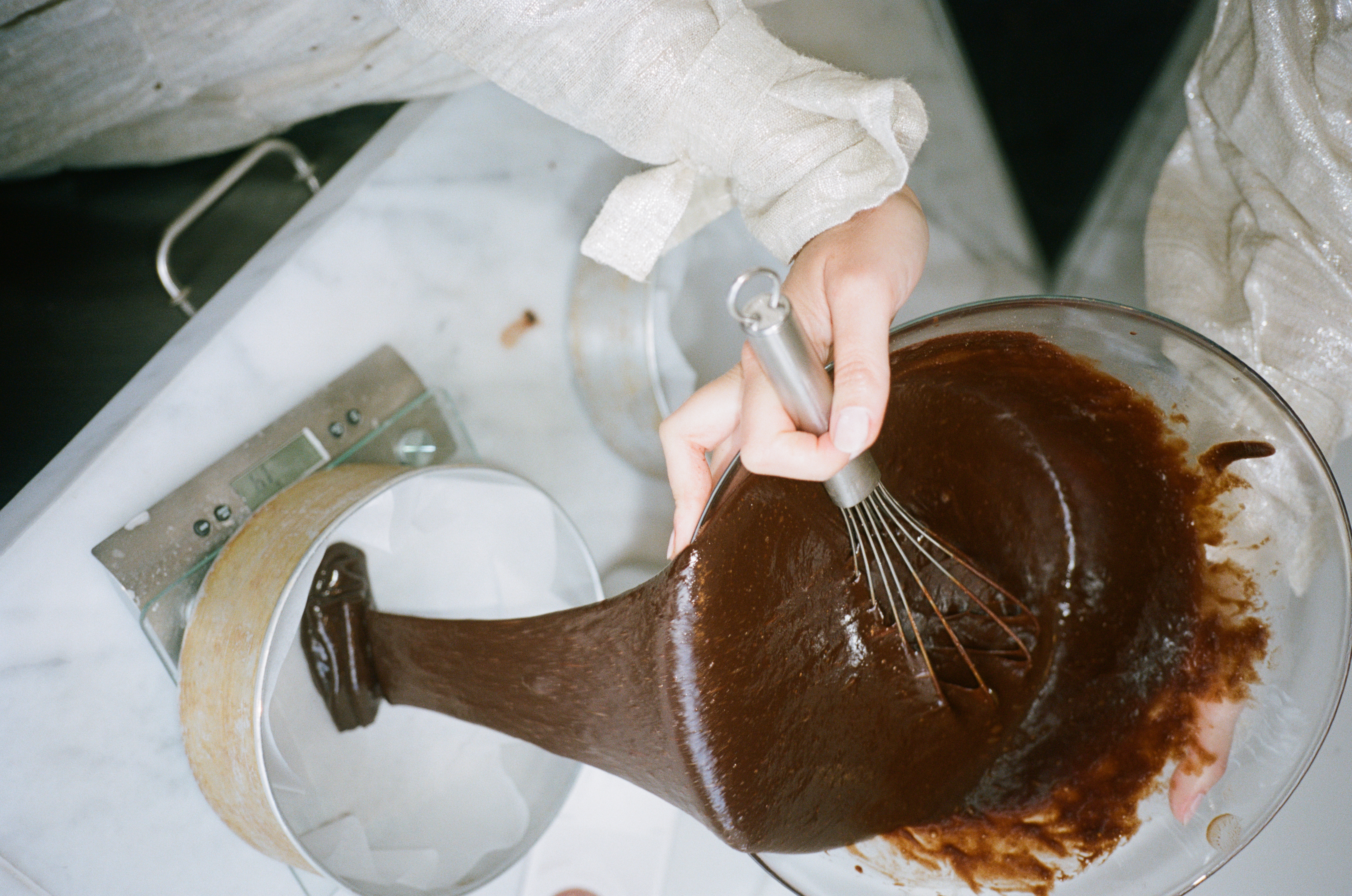 Flourless Dark Chocolate Gold Leaf Cake KitEditorial Image  of person making cake