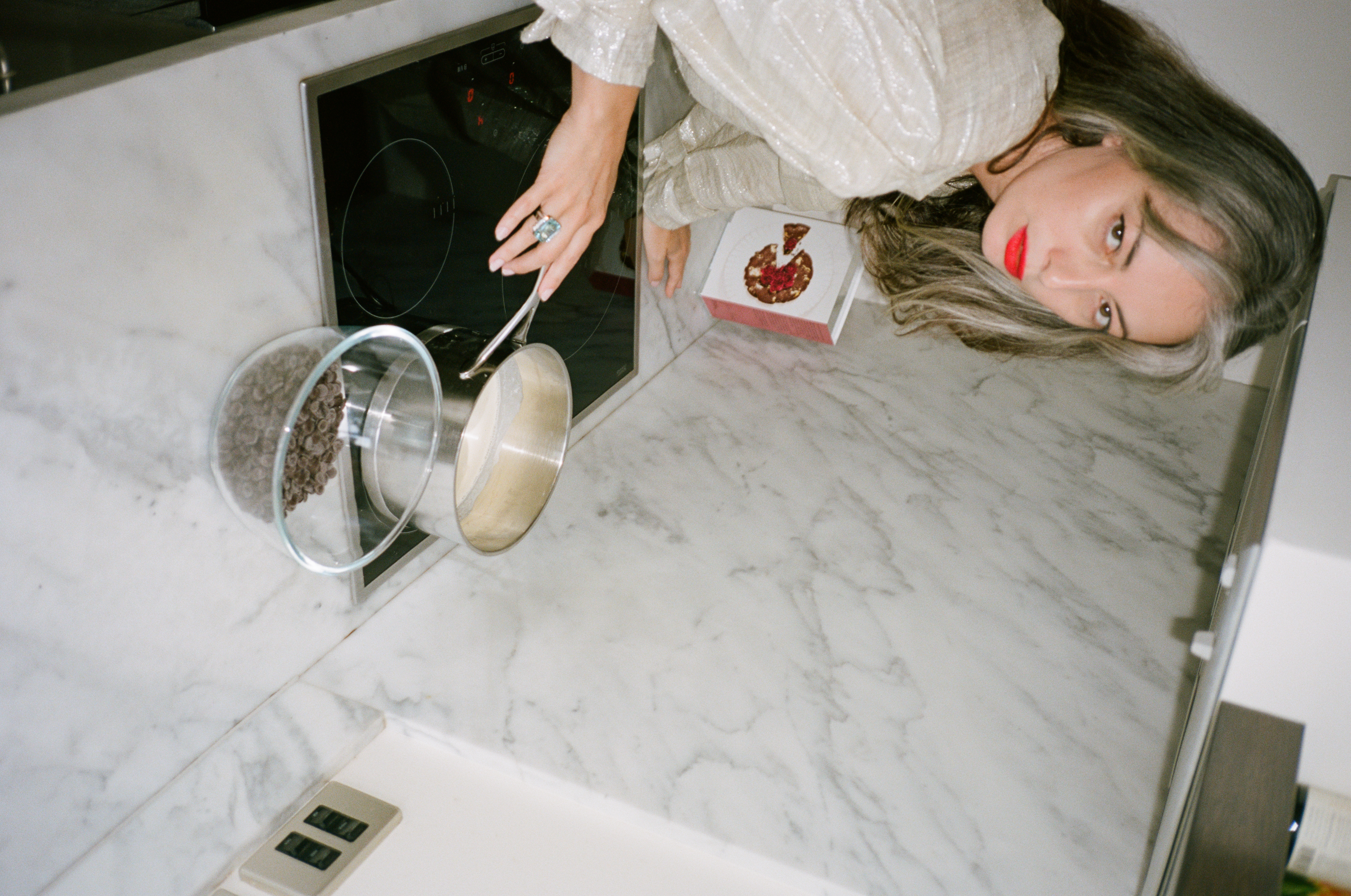 Flourless Dark Chocolate Gold Leaf Cake KitEditorial Image  of person making cake