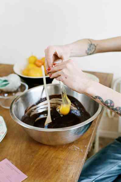 Flourless Dark Chocolate Gold Leaf Cake KitEditorial Image  of person making cake