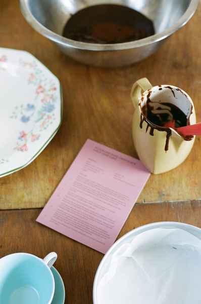 Flourless Dark Chocolate Gold Leaf Cake KitEditorial Image of person making cake