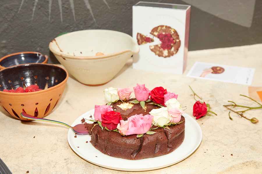 Flourless Dark Chocolate Gold Leaf Cake KitEditorial Image of person making cake