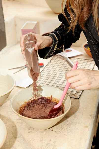 Flourless Dark Chocolate Gold Leaf Cake KitEditorial Image of person making cake