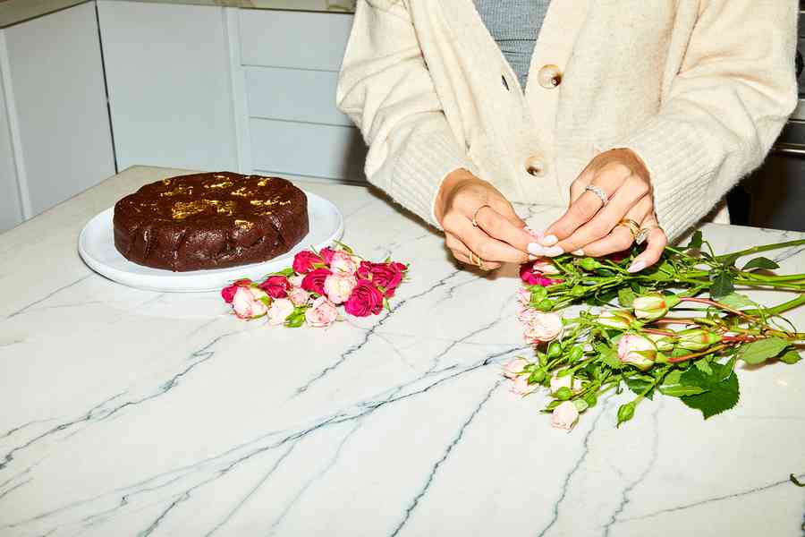 Flourless Dark Chocolate Gold Leaf Cake KitEditorial Image  of person making cake