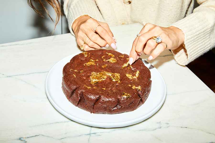 Flourless Dark Chocolate Gold Leaf Cake KitEditorial Image of person making cake