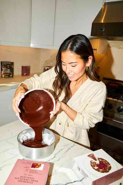 Flourless Dark Chocolate Gold Leaf Cake KitEditorial Image  of person making cake