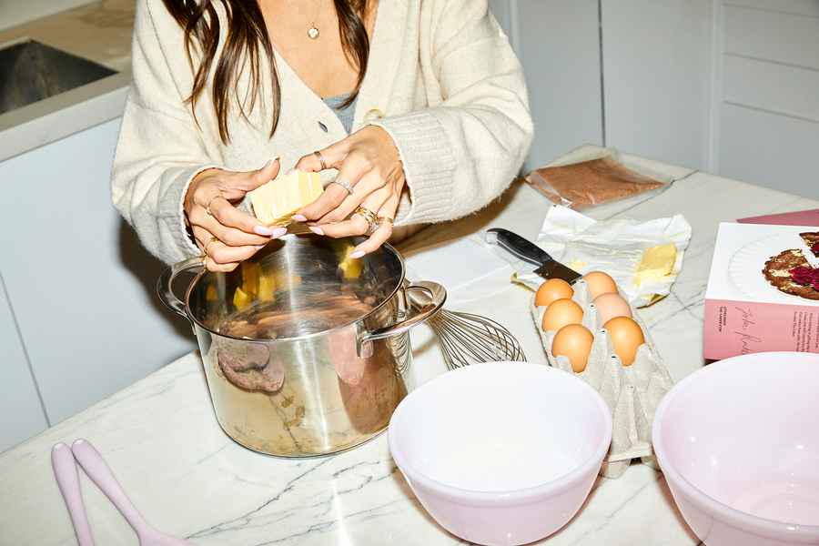 Flourless Dark Chocolate Gold Leaf Cake KitEditorial Image of person making cake