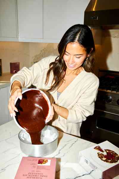 Flourless Dark Chocolate Gold Leaf Cake KitEditorial Image  of person making cake