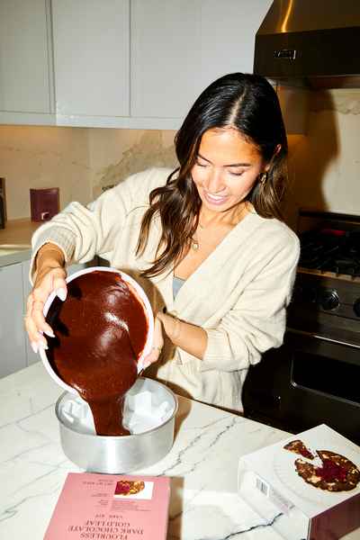 Flourless Dark Chocolate Gold Leaf Cake KitEditorial Image of person making cake
