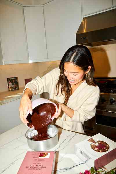 Flourless Dark Chocolate Gold Leaf Cake KitEditorial Image  of person making cake