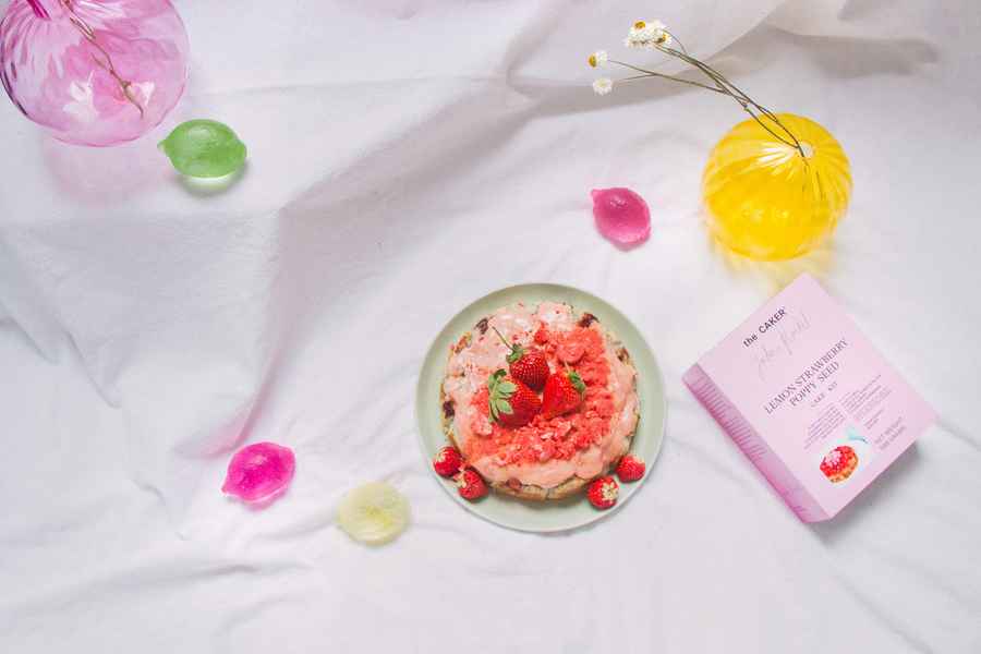 Lemon Strawberry Poppy Seed Cake KitEditorial Image of person making cake