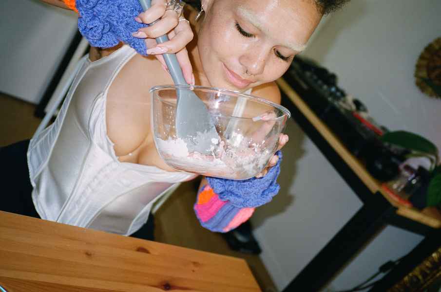 Lemon Strawberry Poppy Seed Cake KitEditorial Image of person making cake