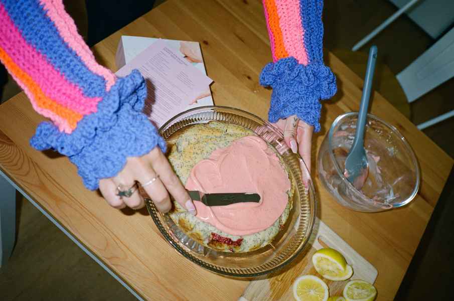 Lemon Strawberry Poppy Seed Cake KitEditorial Image of person making cake